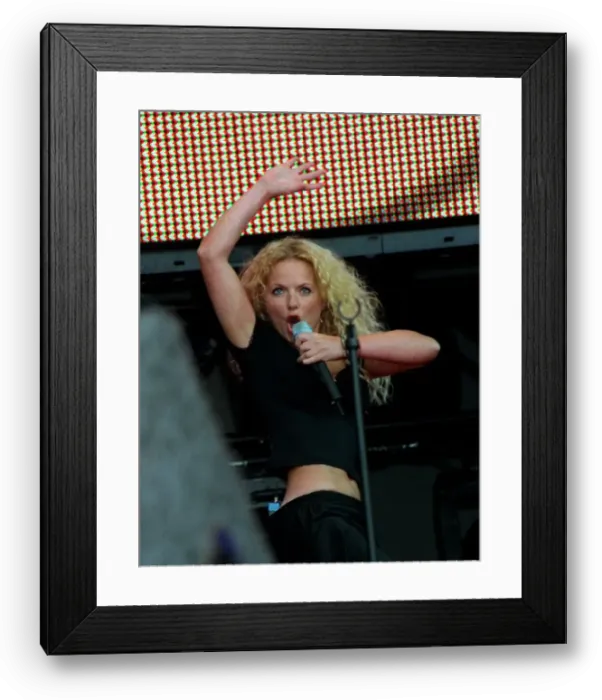 Framed Print : Party in the Park 1999. Geri Halliwell on stage Jul 99 performing to an audience