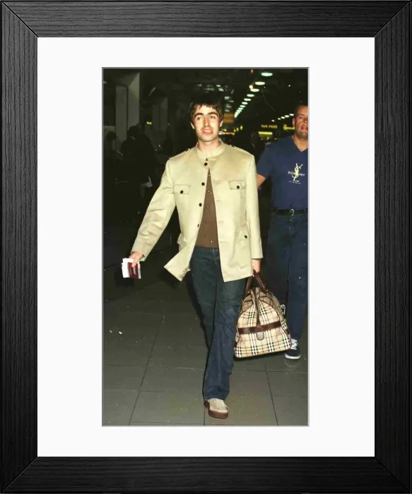 Framed Print : Liam Gallagher Singer of Pop Group Oasis leaving Heathrow Airport for New York where he Framed Print : Liam Gallagher Singer of Pop Group Oasis leaving Heathrow Airport for New York where he