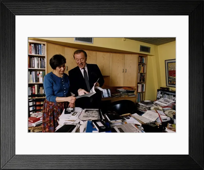 Framed Print : David Frost TV Presenter checking through paperwork with an assistant
