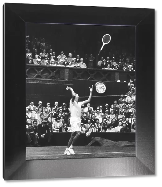 Dick Savitt throws racket in air after winning the 1951 mens singles final against Ken