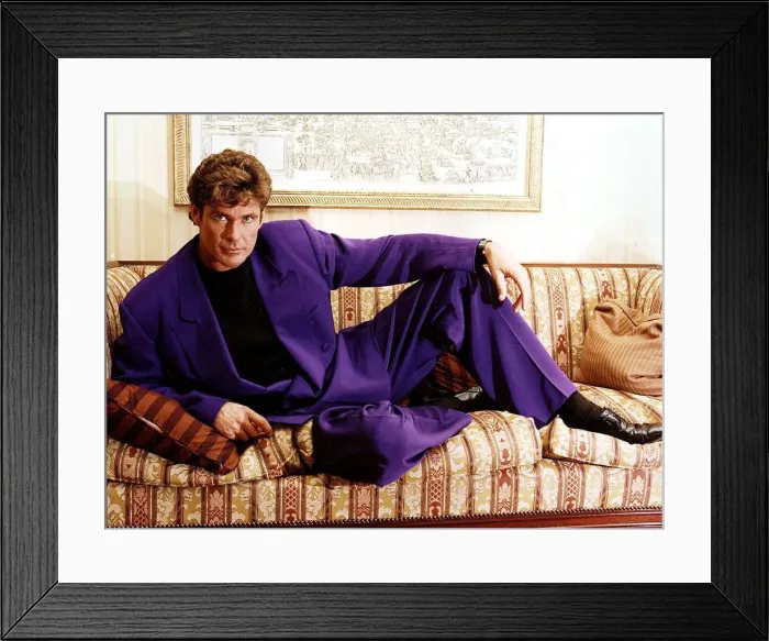 Framed Print : David Hasselhoff actor singer reclining on settee wearing purple suit