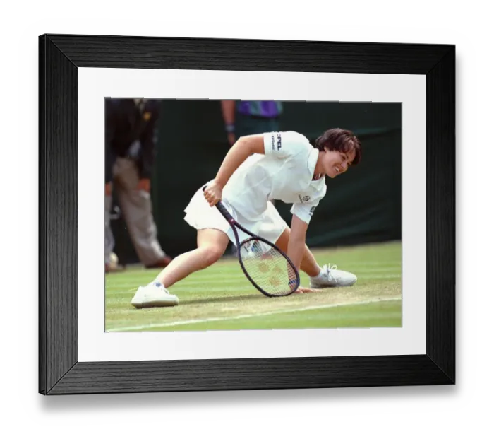 Framed Print : Defending champion Martina Hingis recovers from a slip Framed Print : Defending champion Martina Hingis recovers from a slip
