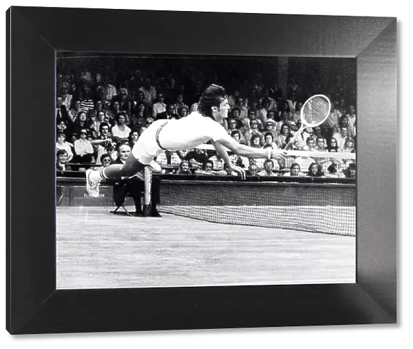 Adriano Panatta Tennis Player diving on court Aug 1976 to score a winning point against