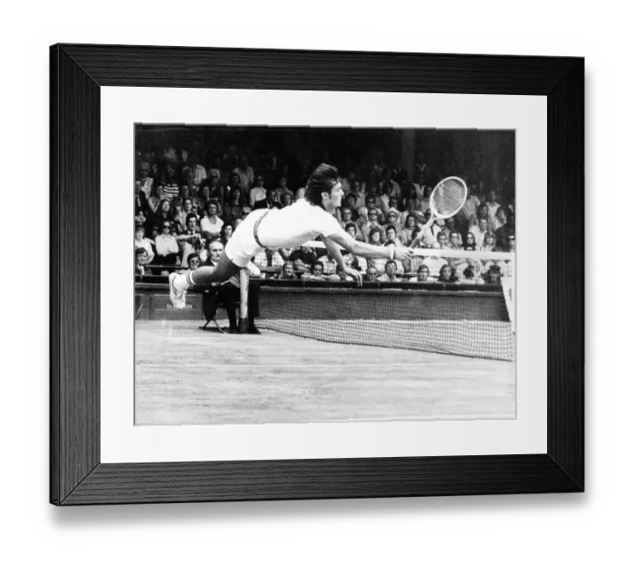 Framed Print : Adriano Panatta Tennis Player diving on court Aug 1976 to score a winning point against Framed Print : Adriano Panatta Tennis Player diving on court Aug 1976 to score a winning point against