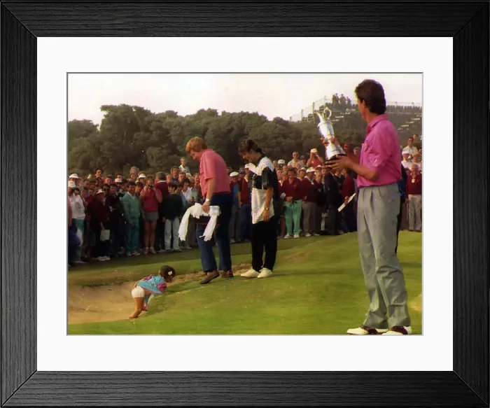 Framed Print : Ian Baker Finch holding trophy watching as daughter is slipping in to bunker on the 18th