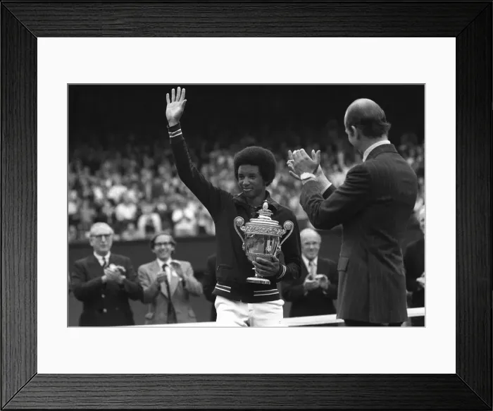Framed Print : Arthur Ashe waves to fans after winning mens title in 1975 at Wimbledon with Duke of Kent