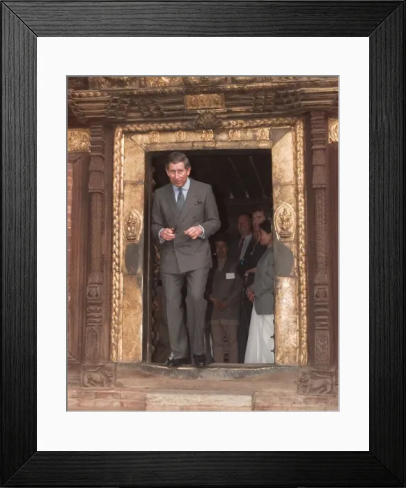 Framed Print : Prince Charles walking through a low temple door during his visit to Kathmandu in Nepal Framed Print : Prince Charles walking through a low temple door during his visit to Kathmandu in Nepal