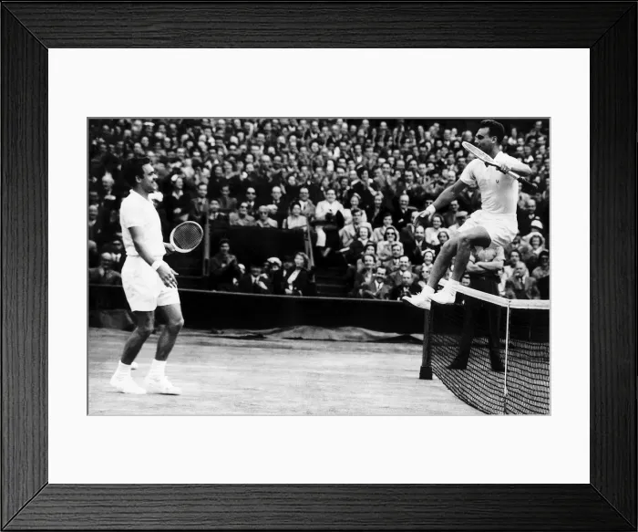 Framed Print : Victor Seixas leaps over net after win against Kurt Nielson in the 1953 Wimbledon mens