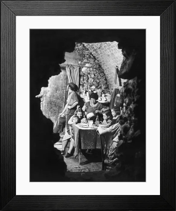 Framed Print : A family eating dinner in the bombed out remains of their cellar. October 1940 Framed Print : A family eating dinner in the bombed out remains of their cellar. October 1940
