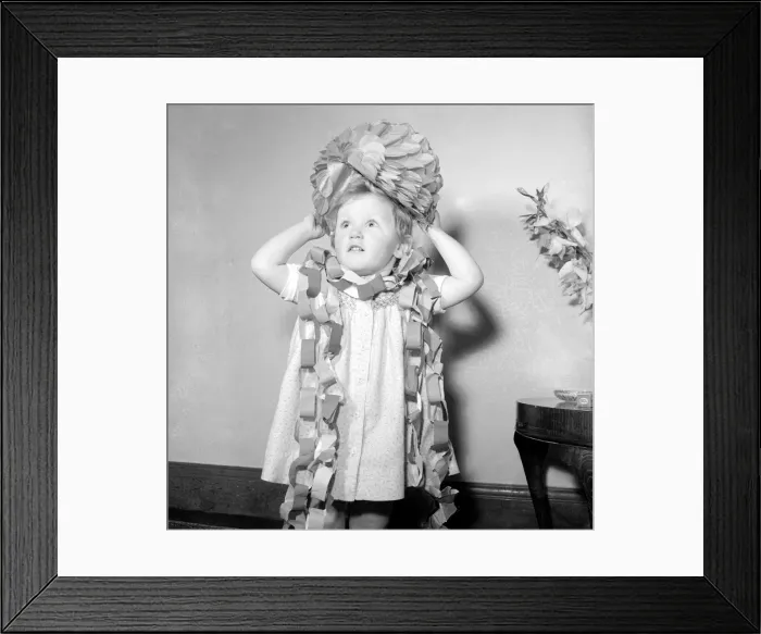 Framed Print : Three year oild Nina Grant seen here playing with christmas decorations December Framed Print : Three year oild Nina Grant seen here playing with christmas decorations December