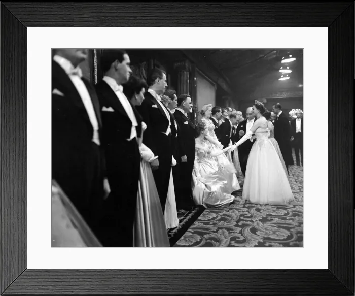 Framed Print : Queen Elizabeth II seen here attending a film premiere of Beau Brammell at the Empire