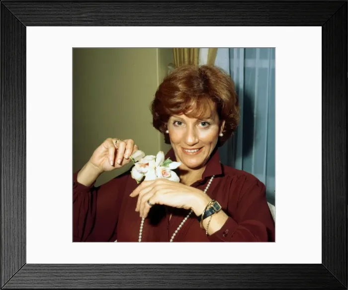 Framed Print : Cynthia Harris actress holding flower November 1978