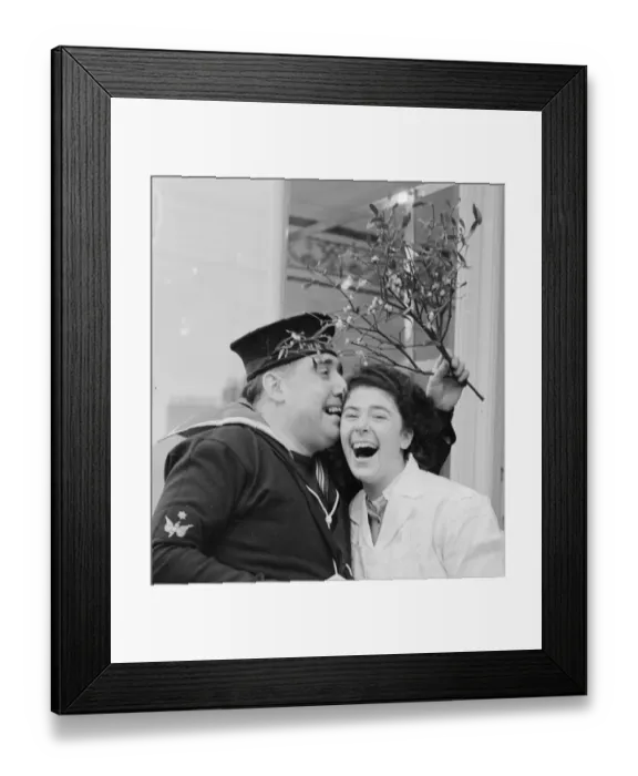 Framed Print : He ll eat the turkey later, but use the mistletoe now