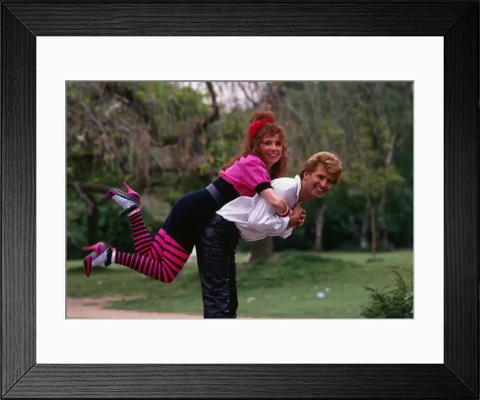 Framed Print : Melanie Hill actress May 1989 Climbing on Vince Brickley back