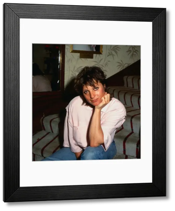 Framed Print : Suzanne Danielle August 1987 actress sitting on stairs hand at chin Framed Print : Suzanne Danielle August 1987 actress sitting on stairs hand at chin