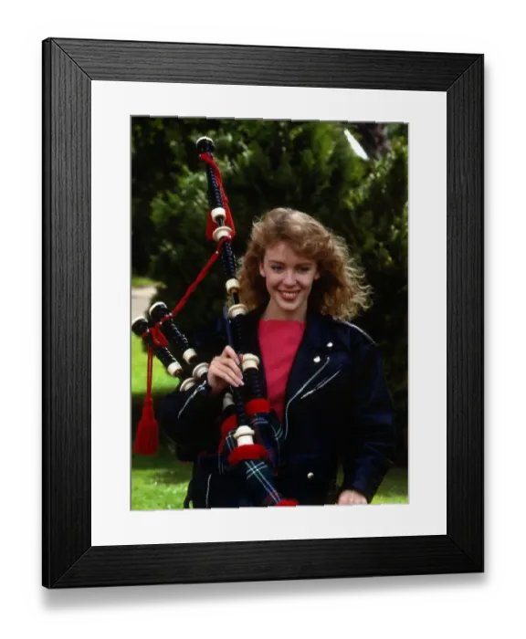 Framed Print : Kylie Minogue holding bagpipes September 1988
