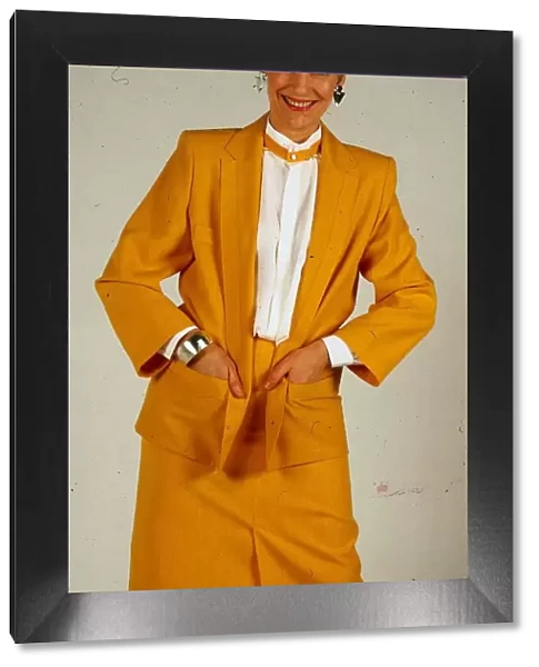 Harriet Buchan actress May 1987 wearing yellow jacket skirt suit and white blouse shirt