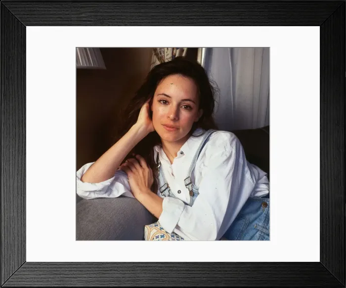 Framed Print : Madeline Stowe actress leaning on sofa hand at face head Framed Print : Madeline Stowe actress leaning on sofa hand at face head