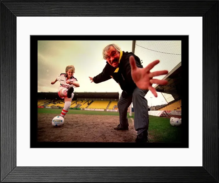 Framed Print : Lesley Fitzsimons actress kicks ball past Jim Leishman March 1998 PIC BY CHRIS Framed Print : Lesley Fitzsimons actress kicks ball past Jim Leishman March 1998 PIC BY CHRIS