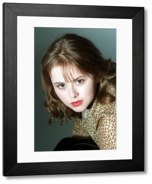 Framed Print : Catriona Evans looking sultry wearing leopard design silk blouse light brown shoulder Framed Print : Catriona Evans looking sultry wearing leopard design silk blouse light brown shoulder