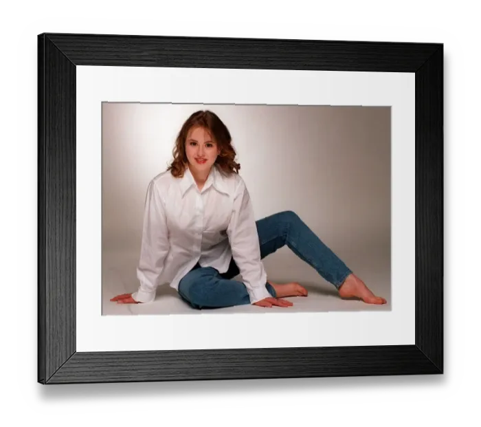 Framed Print : Catriona Evans sitting on floor wearing blue denims and white long sleeved blouse light Framed Print : Catriona Evans sitting on floor wearing blue denims and white long sleeved blouse light