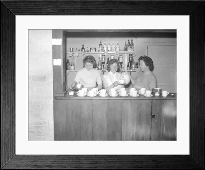 Framed Print : Ladies pour the tea, ready for the rush at half-time during the Motoball match