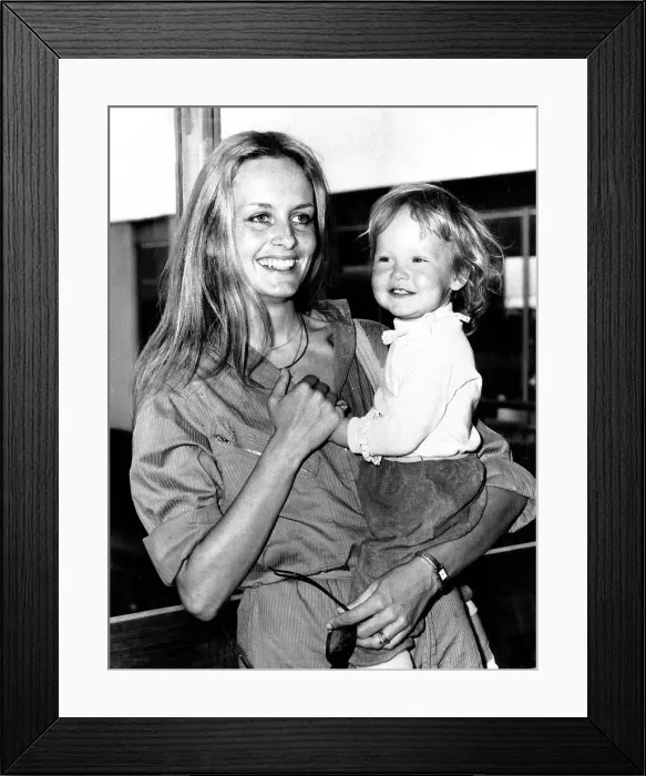 Framed Print : Twiggy Model and Actress holding baby Framed Print : Twiggy Model and Actress holding baby