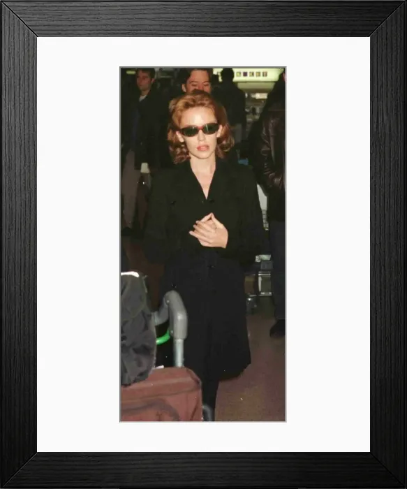 Framed Print : Actress and singer Kylie Minogue leaving Heathrow for Glasgow