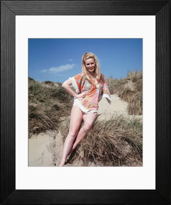 Framed Print : Veronica Carlsone actress who appeared in Hammer Horror films, poses on Camber Sands Framed Print : Veronica Carlsone actress who appeared in Hammer Horror films, poses on Camber Sands