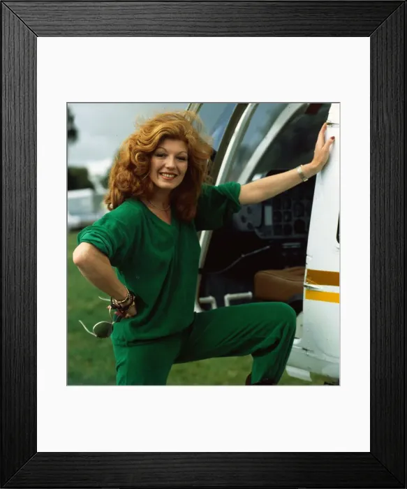 Framed Print : Rula Lenska sdtanding next to helicopter August 1985