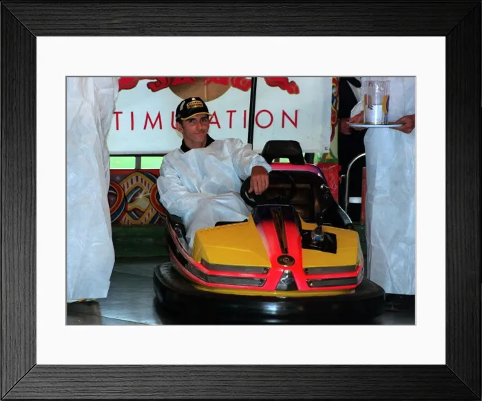 Framed Print : Damon Hill Drivers ball 1999 before Silverstone Grand Prix He takes a ride on the Dogems