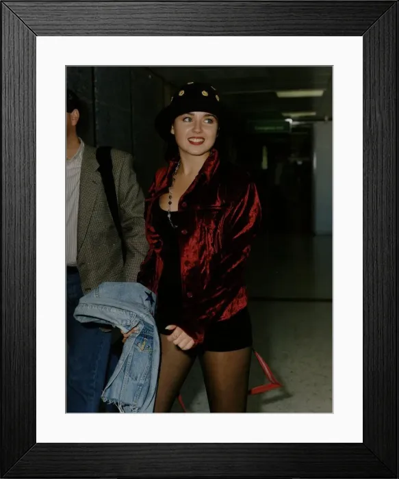 Framed Print : Dannii Minogue -Singer  /  Actress at the airport wearing shorts and hat