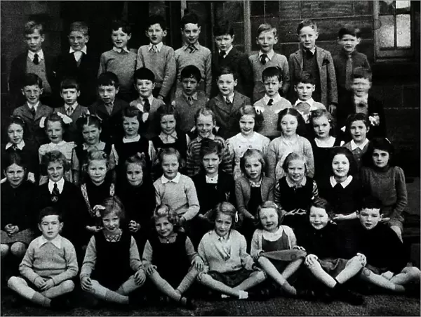 Jackie Stewart pictured as young boy in a school group photograph in Dumbarton