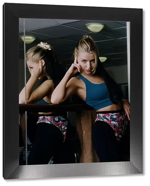 Dannii Minogue -Singer  /  Actress in gym leotard mirror