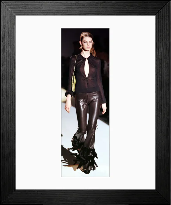 Framed Print : A model models at the Face of Guccis Fashion Show March 1999 wearing a