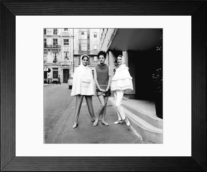 Framed Print : The cape became the item every girl wanted in 1962. These models posed in the street