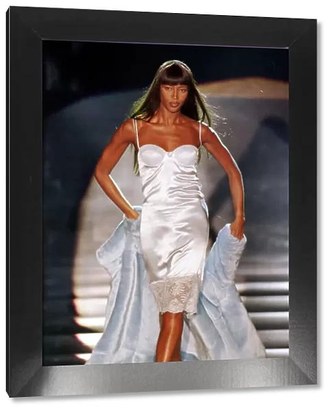 Naomi Campbell modelling a white slip dress March 1999 for designer Rocco Barocco