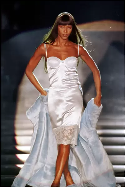 Naomi Campbell modelling a white slip dress March 1999 for designer Rocco Barocco