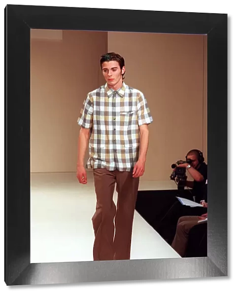Male model on catwalk in Designworks show for mens 1998 fashion week wearing check