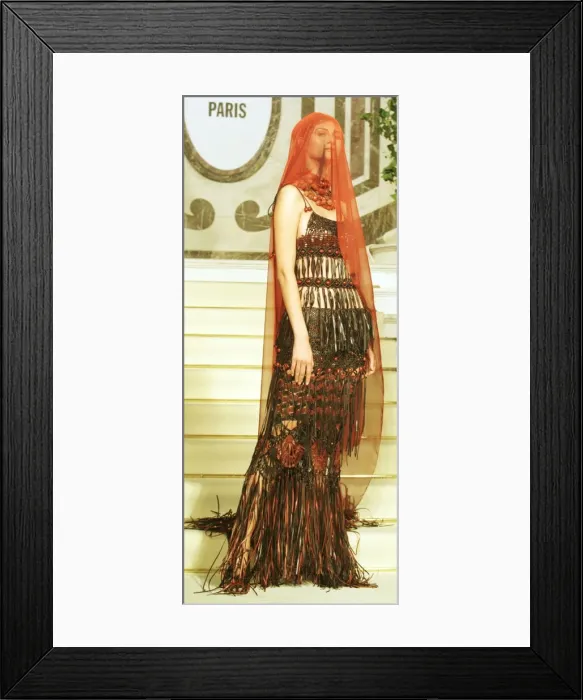 Framed Print : A model wears a Jean Paul Gaultier design January 1999 at his show during Paris