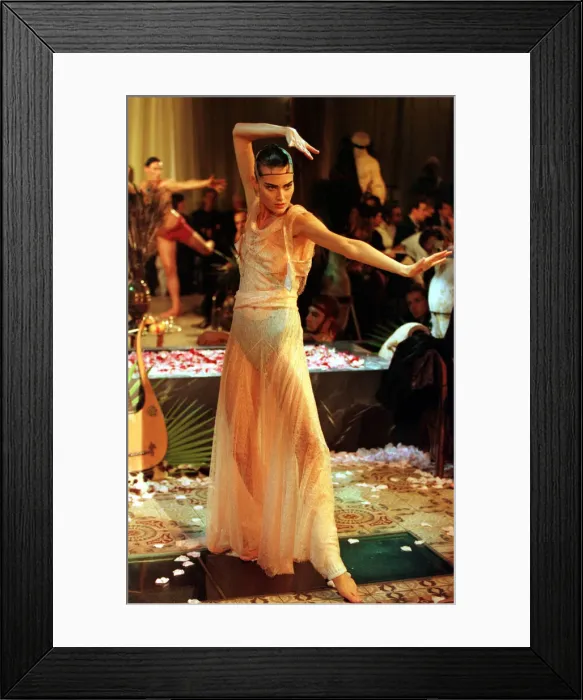 Framed Print : John Galliano fashion show Paris October 1998 Model wearing a cheer white Egyptian Framed Print : John Galliano fashion show Paris October 1998 Model wearing a cheer white Egyptian