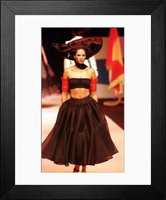 Framed Print : A model walking down the catwalk October 1997 showing Christian Lacroix latest designs in