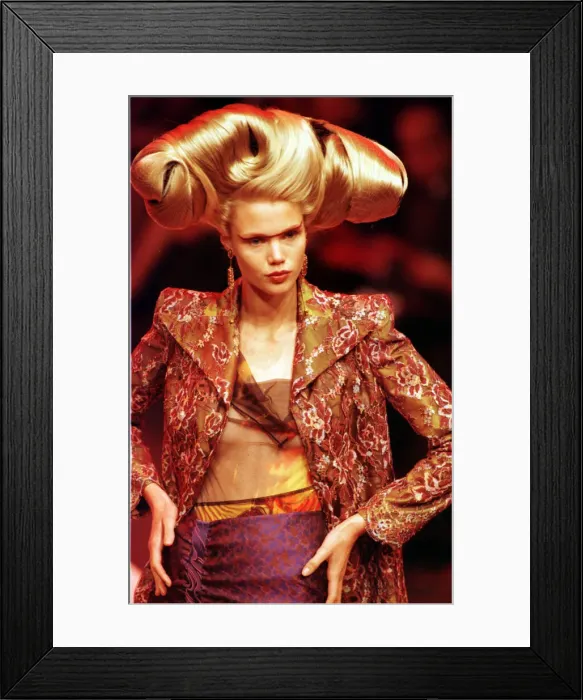 Framed Print : A model walking down the catwalk October 1997 showing Christian Lacrioxs latest designs