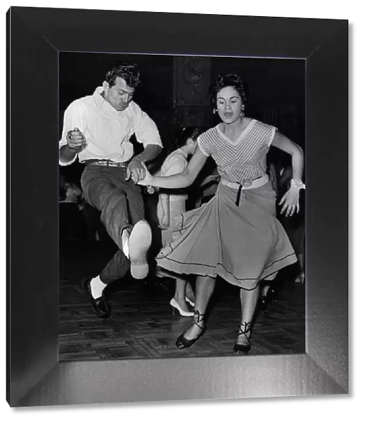A couple demonstrate rock n roll dancing at the Lyceum in London