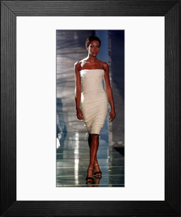 Framed Print : Naomi Campbell wearing a white evening dress July 1998 as part of Donatella Framed Print : Naomi Campbell wearing a white evening dress July 1998 as part of Donatella