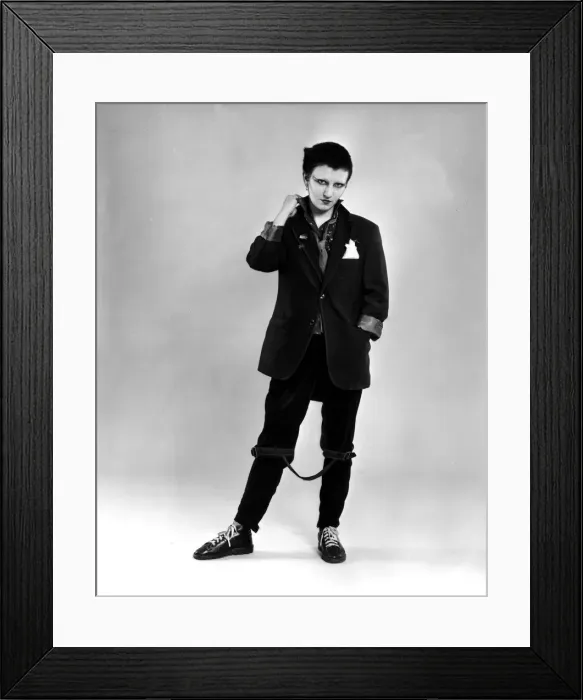 Framed Print : Punk rocker fashion Black jacket and trousers, dyed black hair Framed Print : Punk rocker fashion Black jacket and trousers, dyed black hair