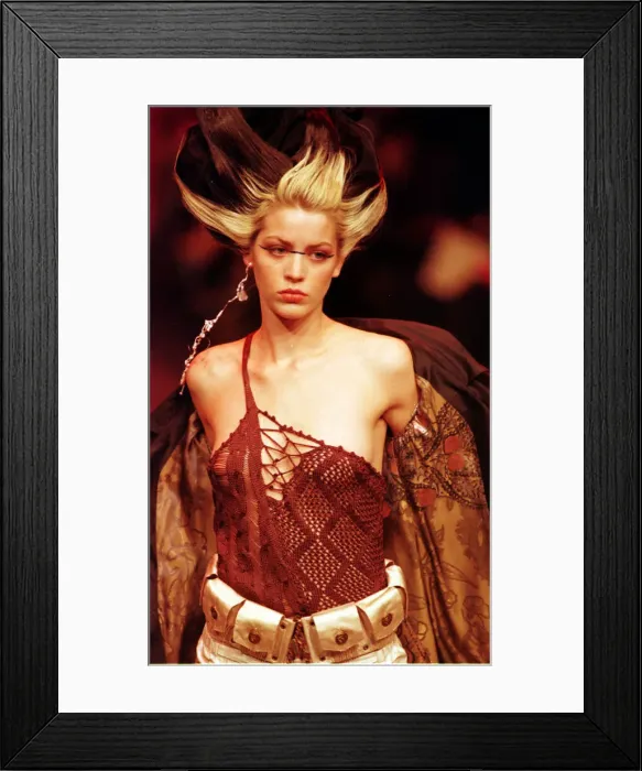 Framed Print : A model sports a red knitted top October 1997 designed by Christian Lacroix for