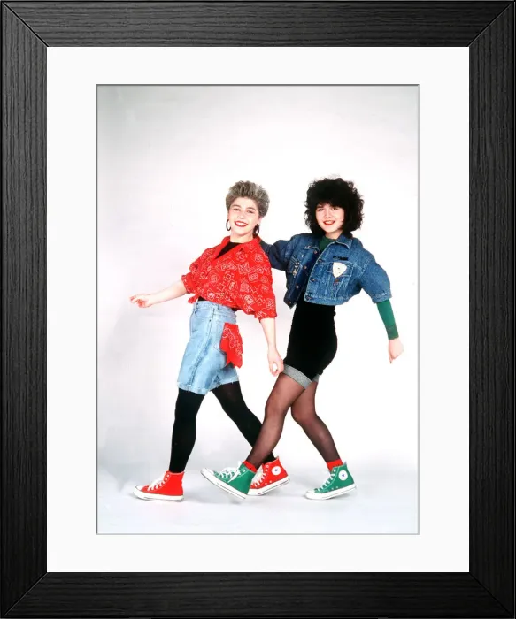Framed Print : The Reynolds Girls wearing shirts shorts trainers and tights, dancing