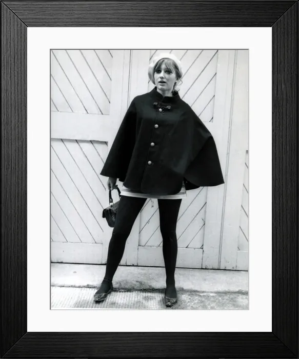 Framed Print : Fashion 1960s Model wearing a black cape, white beret Framed Print : Fashion 1960s Model wearing a black cape, white beret