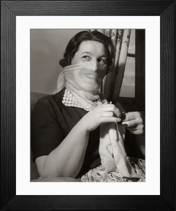 Framed Print : Mrs F Sharpen wearing a veil as she knits at home 1956 Framed Print : Mrs F Sharpen wearing a veil as she knits at home 1956